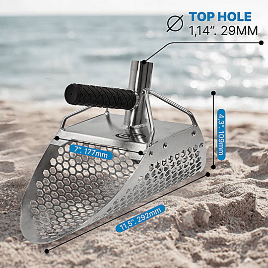 Metal spade with measurements on a beach background
